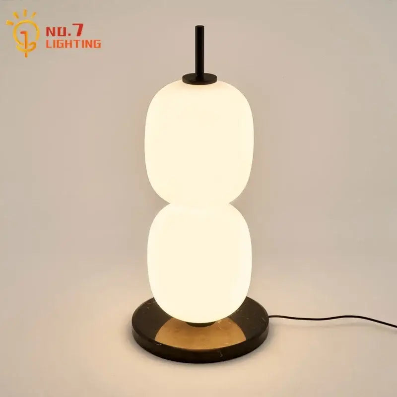 Modern glass gourd table lamp with two stacked oval glass shades black metal stem and marble base for bedroom decorbites glass gourd