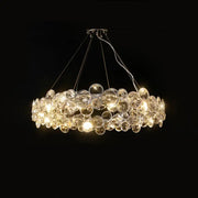 A modern pendant light featuring clear glass orbs in overlapping layers from decorbites crystal magic ring series