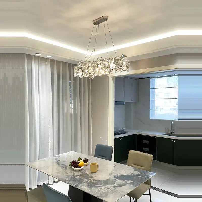 Modern glass orb crystal magic ring pendant light with clear faceted glass orbs on a sleek metallic frame for living room decorbites crystal magic