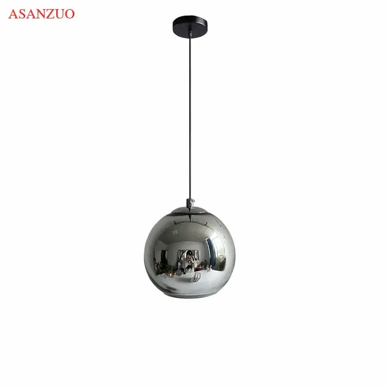 Asanzuo modern glass pendant lights with spherical chrome finish and black cable create an inviting atmosphere