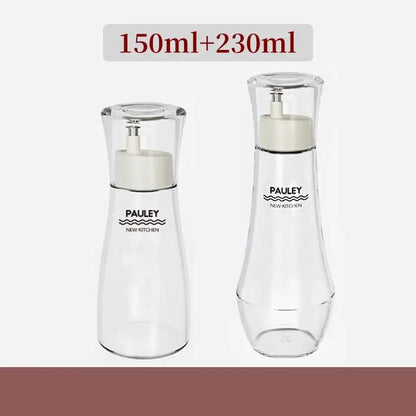 Clear glass pauley new kitchen glass seasoning bottle set with white pump tops and minimalist branding for oil dispensing