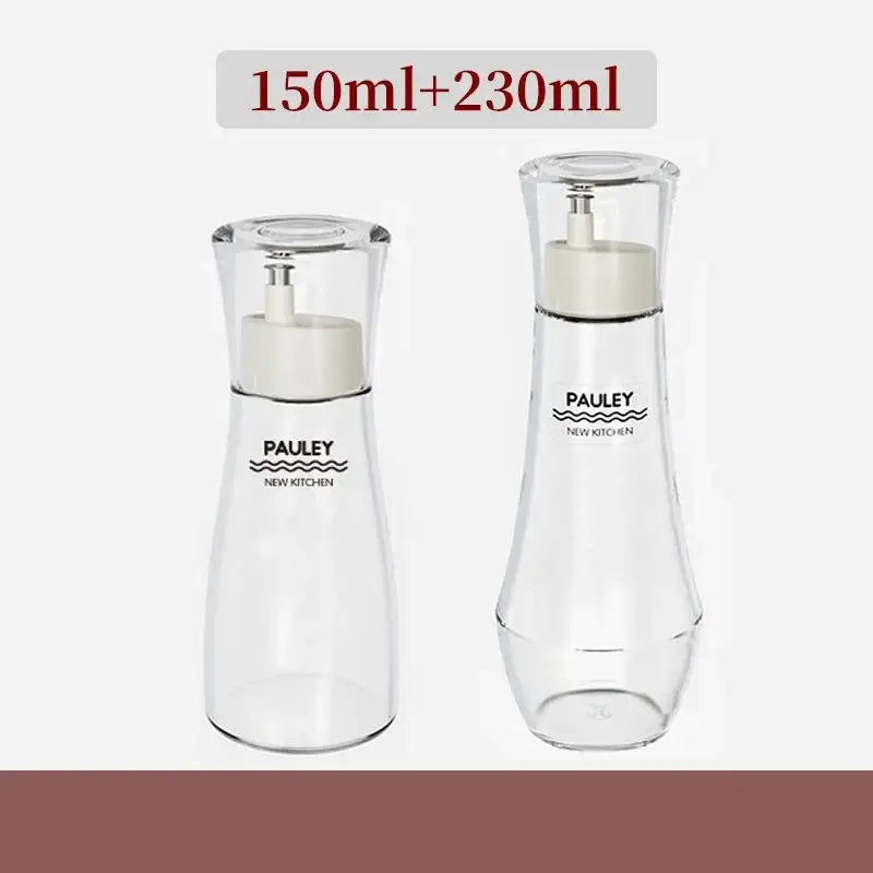 Clear glass pauley new kitchen glass seasoning bottle set with white pump tops and minimalist branding for oil dispensing