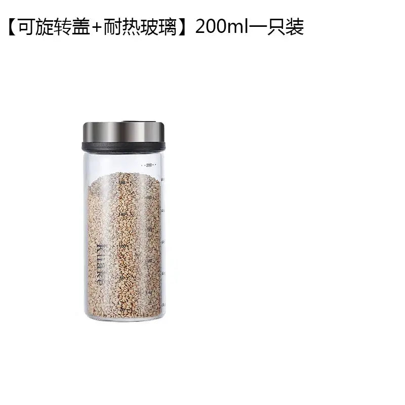 Modern glass seasoning spice shaker salt with clear glass, silver rotating lid, and measurement markings for kitchen use