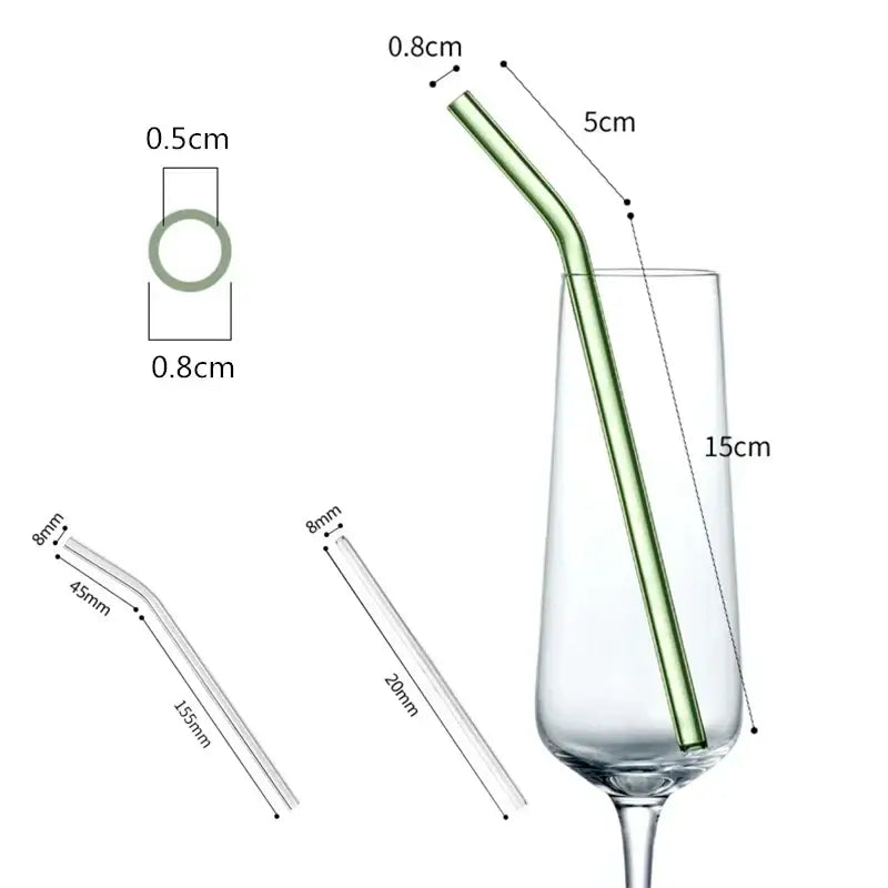 Slender translucent green glass straw with curved design in champagne flute from decorbites glass straw set