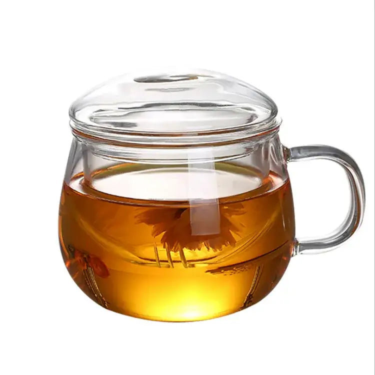 Modern glass tea cup with lid and flower-shaped infuser filled with amber glass tea for kitchen drinkware
