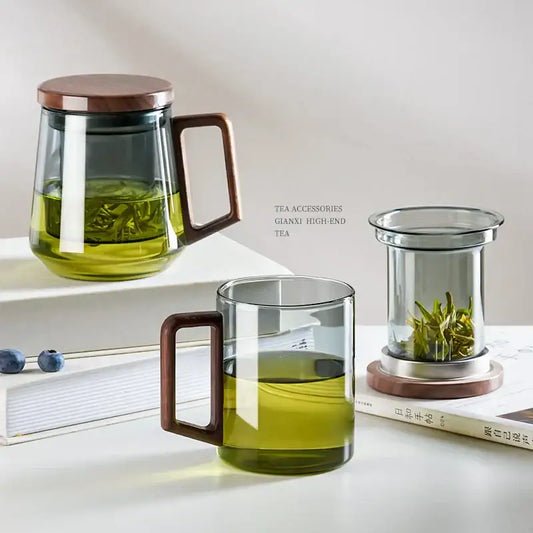 Clear glass teapot with wooden lid and handle filled with green tea for modern kitchen decorbites glass tea use