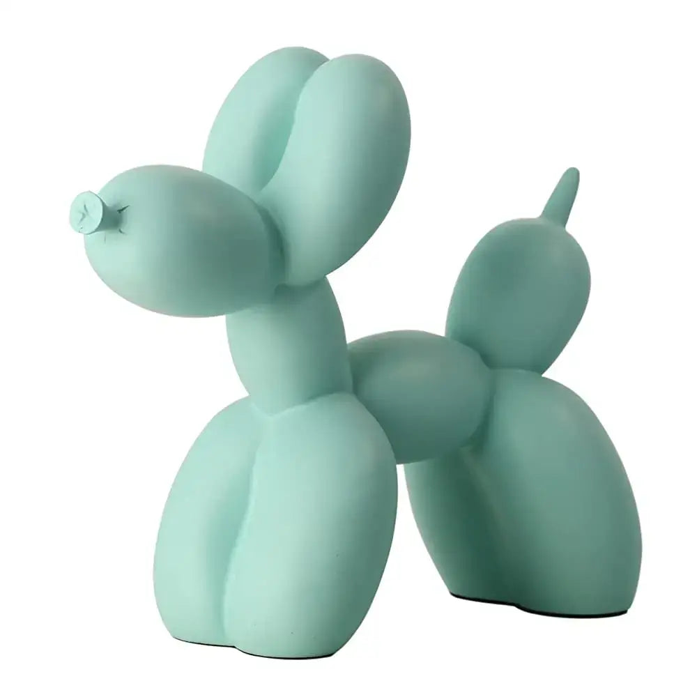 A matte mint-green balloon dog sculpture with smooth contours and a metallic nozzle for modern living room decor