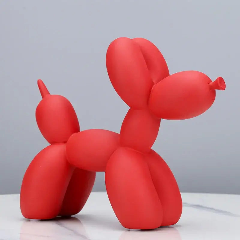 Red balloon dog sculpture with smooth glossy finish modern animal decor for living room display