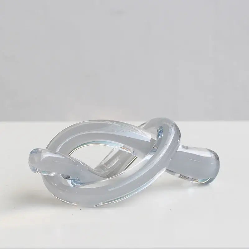 Modern glossy black geometric glass sculpture with smooth transparent knot design for living room decorbites decor