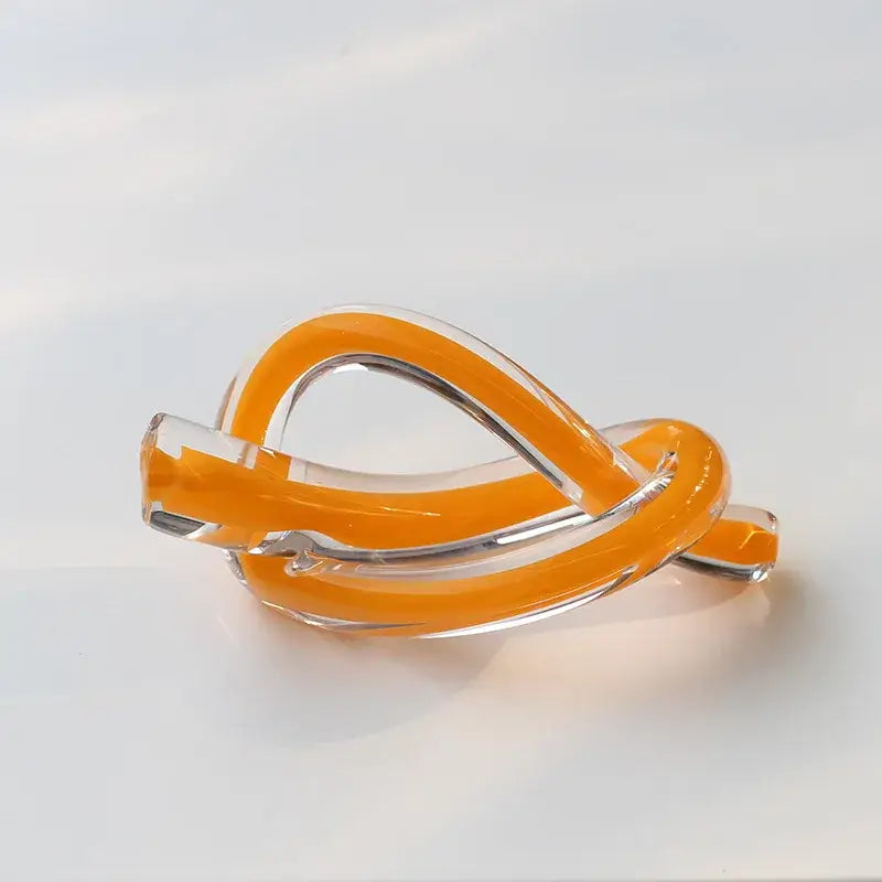 Modern glossy black geometric glass sculpture with orange and clear glass twine bangle for living room decorbites decor