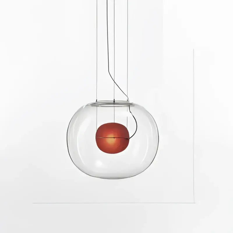 Modern glossy black glass ball pendant light with clear glass globe and warm amber bulb for dining room decorbites brokis big