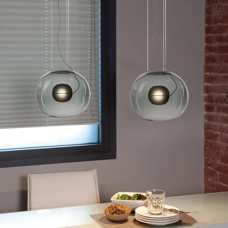 Modern glossy black glass ball pendant light with metallic spheres inside by decorbites brokis big for dining room decor