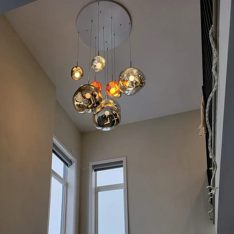 Modern glossy copper glass lava led pendant lights featuring spherical glass bulbs in gold and chrome finishes for living room decorbites glass lava