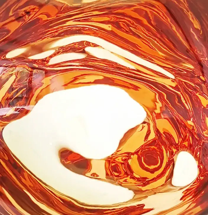 Modern glossy copper glass lava led pendant lights featuring swirling amber liquid with creamy white decorbites glass lava design