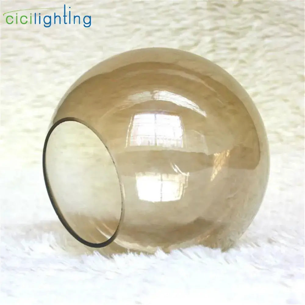 Modern glossy gold grey glass lamp shade featuring a translucent amber rounded grey glass lamp with dark rim decorbites grey glass
