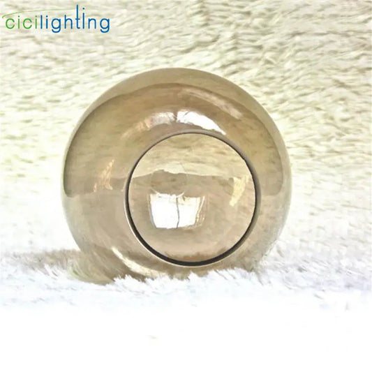 Modern glossy gold grey glass lamp shade with a reflective spherical design and central circular opening for decorbites grey glass lamp