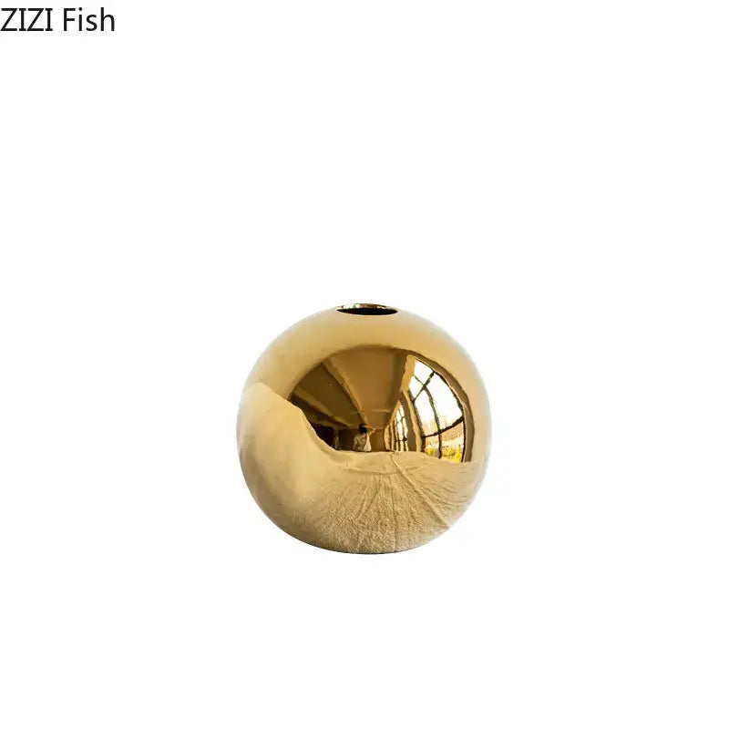 Shiny golden ball ceramic vase with smooth reflective surface and small opening for decorbites golden ball living room decor