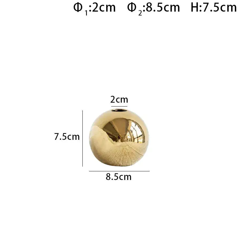 A sleek golden ball ceramic vase with a glossy finish and small opening for modern decorbites golden ball decor