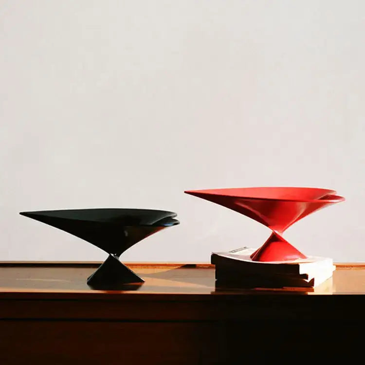 Black and red ceramic serving bowls with sleek modern geometric designs for decorbites geometric fruit display