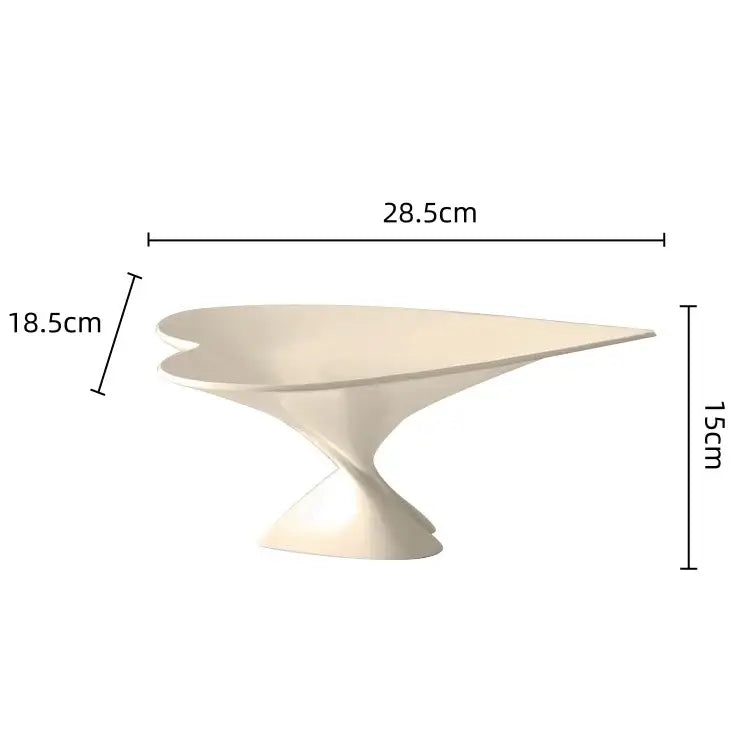 Cream-colored sleekly curved dessert stand with modern sculptural design for decorbites geometric fruit and fruit plate jewelry use