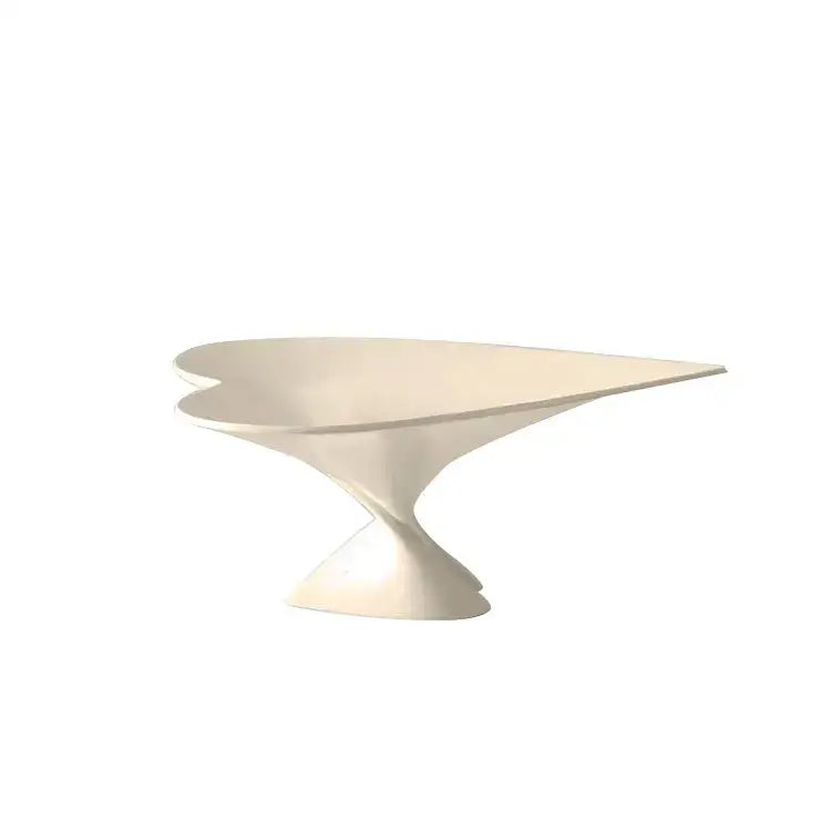 Cream-colored sleekly curved dessert stand with a modern sculptural design for decorbites geometric fruit use
