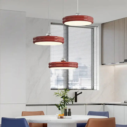 Three vibrant red glossy circular dimmable pendant lights ideal for modern dining room decorbites circular dimmable design