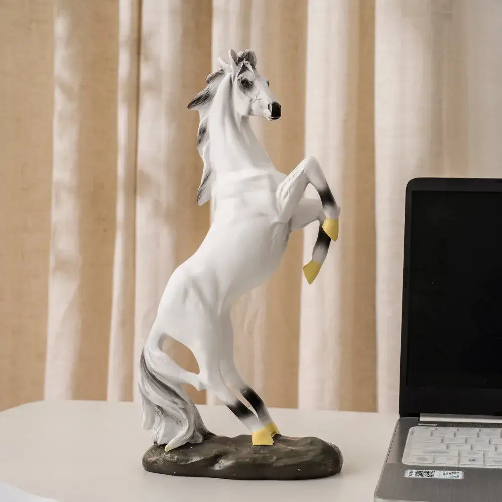 Modern glossy resin horse statue decorbites horse statue white and black with yellow hooves on dark base for living room decor
