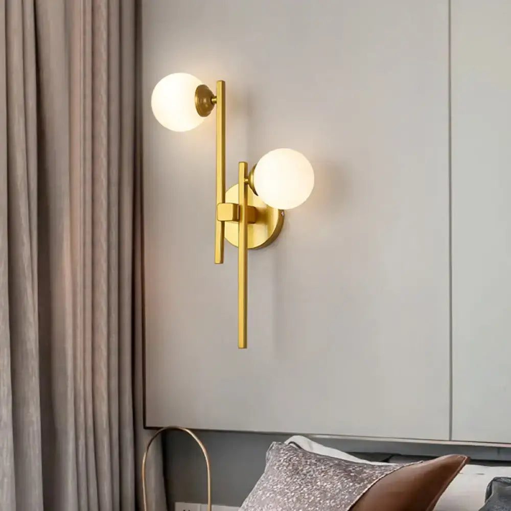 Modern gold 2-light wall lamp with spherical frosted glass shades for living room glass sconce lighting type