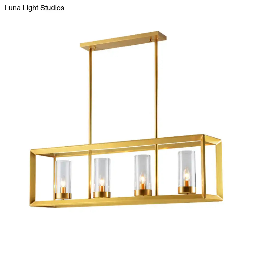 Gold-finished rectangular pendant light with clear glass shades and warm bulbs, ideal for dining room illumination