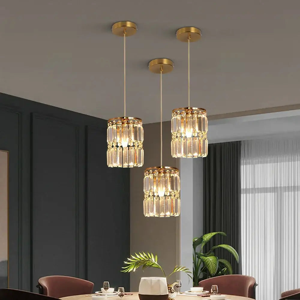 Modern gold chandelier pendant light with three tiered clear crystal cascades ideal for dining room lighting
