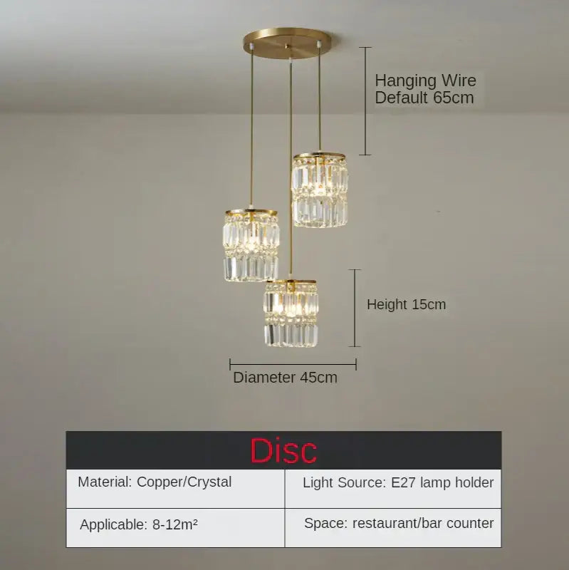 Modern gold chandelier pendant light with three cascading crystal tiers suspended by copper wires for dining room