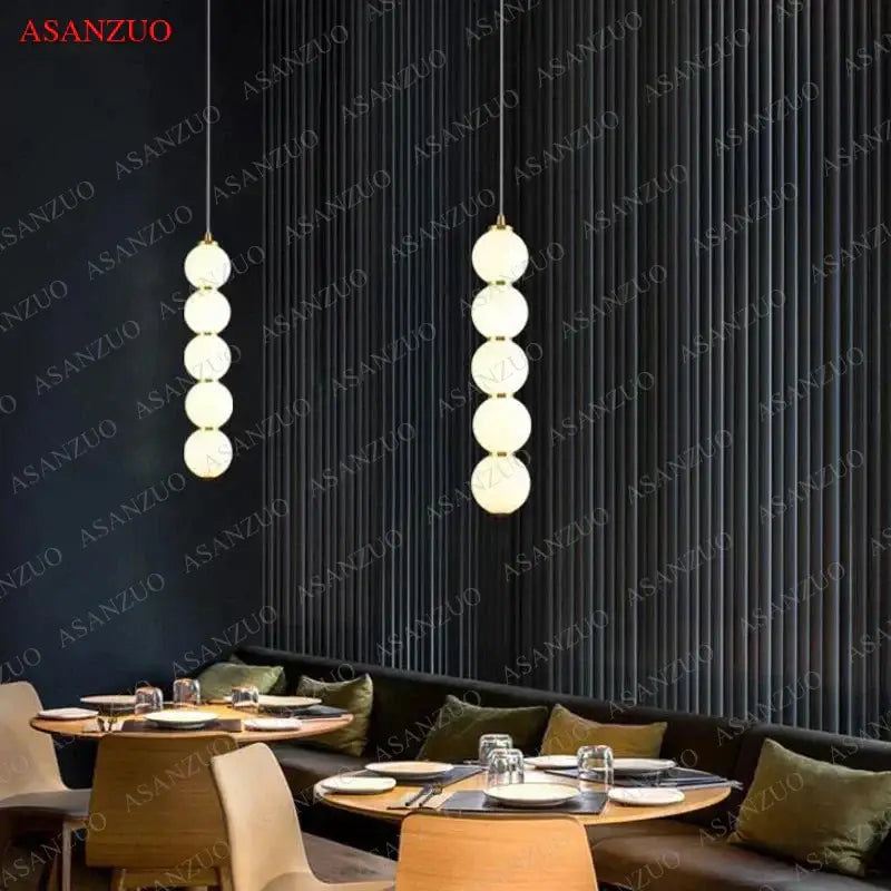 Two elegant modern gold 5-sphere glass ball pendant lights for dining room decorbites glass ball pendant cascade