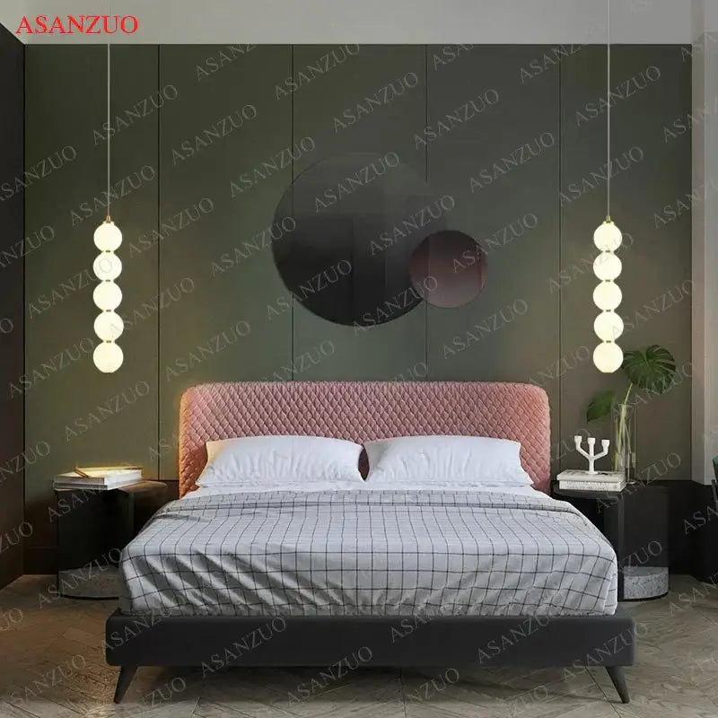 Modern gold 5-sphere glass ball pendant lights with pink quilted velvet headboard and decorbites glass ball design