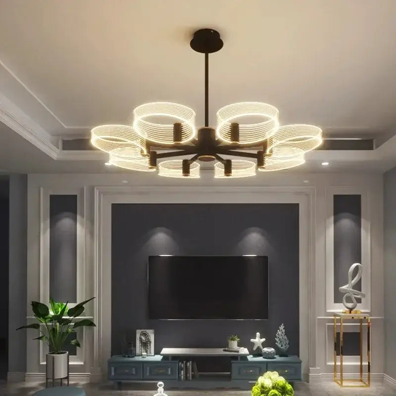 Modern gold acrylic lustre chandelier with dark bronze finish and glowing circular rings by decorbites acrylic lustre