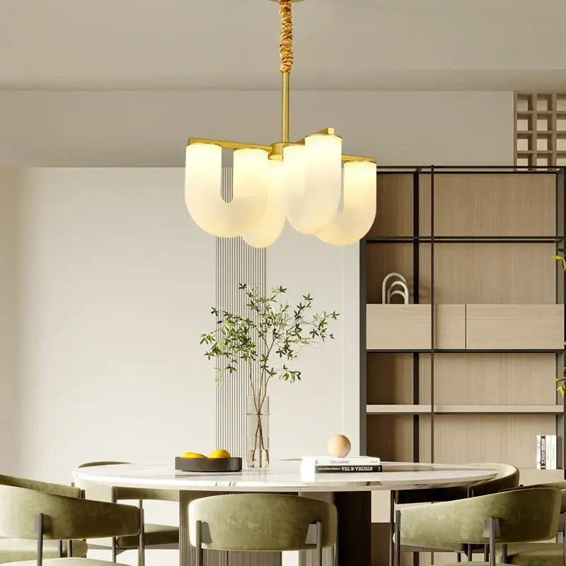 Modern gold acrylic pendant lights featuring a gold metal frame and frosted glass shades in cloud design for dining rooms