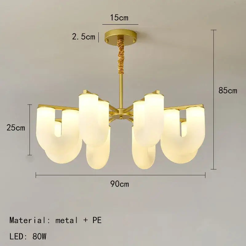 Modern gold metal pendant lights with six frosted white acrylic shades in an asymmetrical dining room design