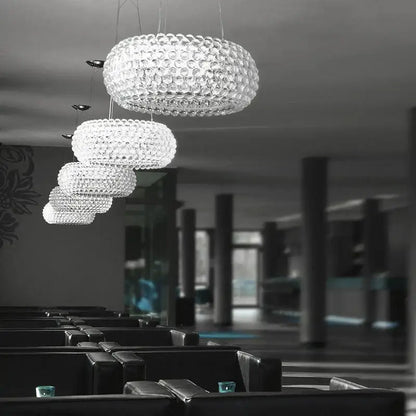 Modern gold acrylic rs7 bulb pendant lights featuring a clear bubble-like crystal tiered chandelier for dining room decorbites