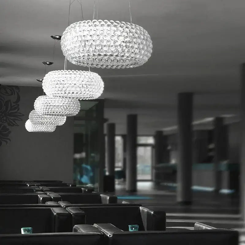 Modern gold acrylic rs7 bulb pendant lights featuring a clear bubble-like crystal tiered chandelier for dining room decorbites