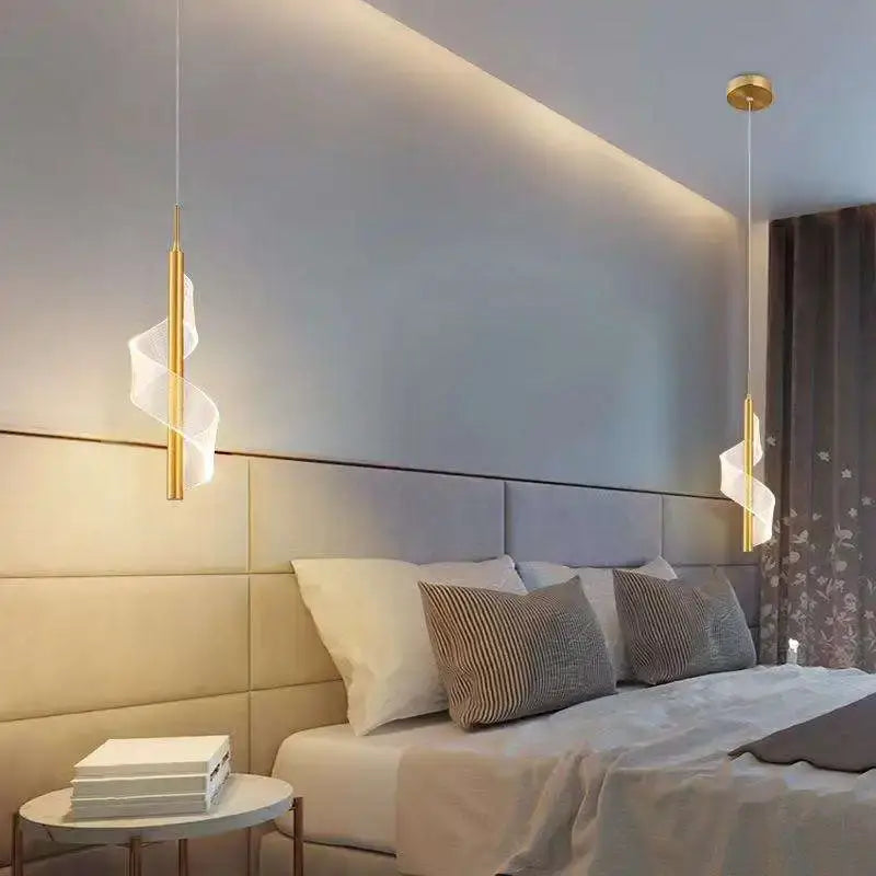 Modern gold acrylic spiral pendant lamp with translucent white fabric accents hanging above the bed decorbites acrylic spiral
