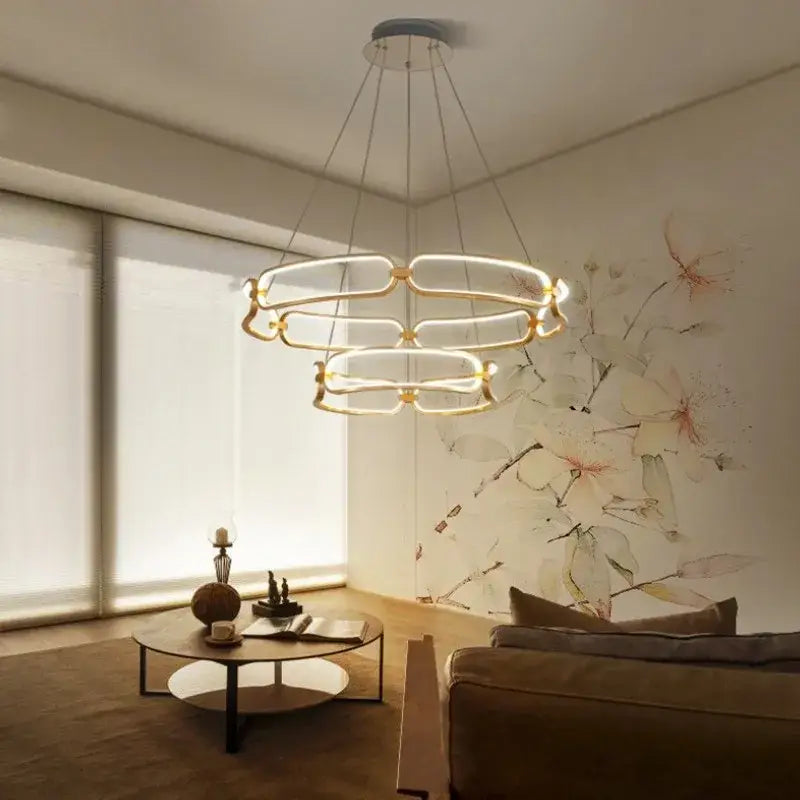 Modern gold adara luxury led ring-shaped pendant light with illuminated glass panels for elegant dining room decorbites adara luxury