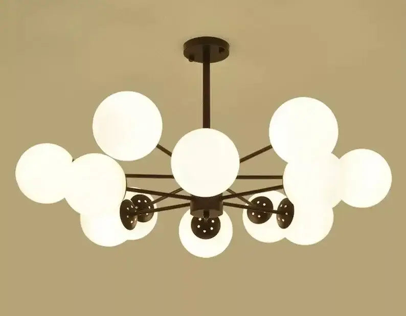 Modern black metal adjustable ball glass chandelier with frosted white globes ideal for dining room decorbites lustre