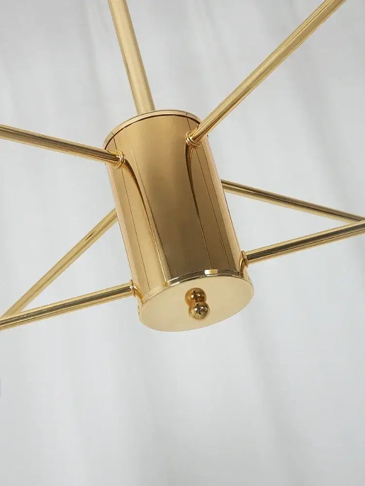Modern gold-toned brass adjustable ball glass lustre with cylindrical body and geometric arms for dining room decorbites light