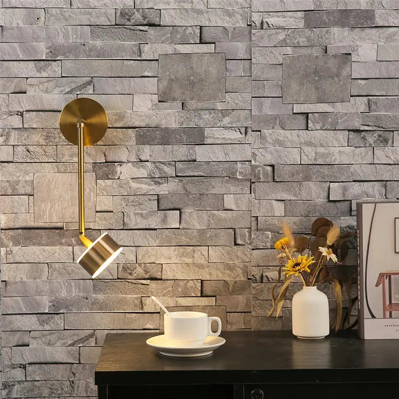 Modern gold adjustable direction wall lamp with sleek cylindrical head and arm for bedroom spotlight decorbites wall light