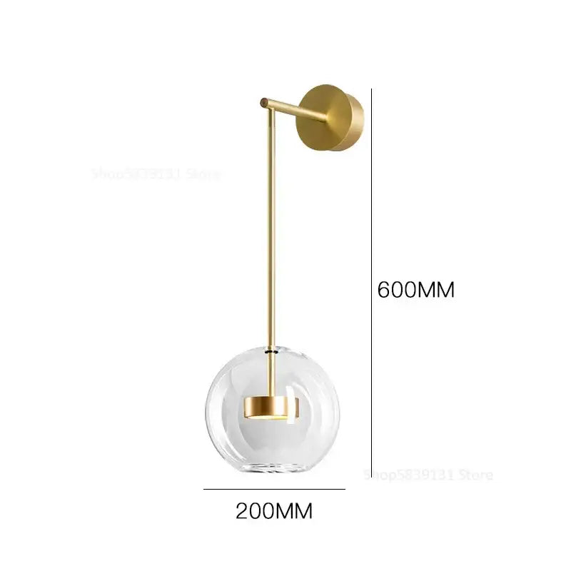 Modern gold wall lamp with adjustable direction featuring a clear glass globe and slender metallic stem for bedroom decorbites wall light