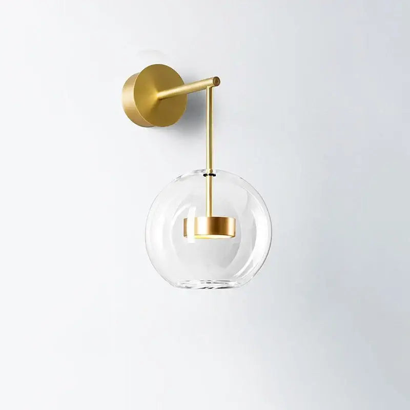 Modern gold adjustable direction wall lamp with clear glass globe and minimalist design for bedroom spotlight decorbites wall light