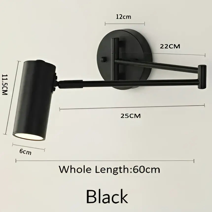 Black adjustable long arm wall lamp with cylindrical shade and articulated arm by decorbites for modern bedroom reading decor