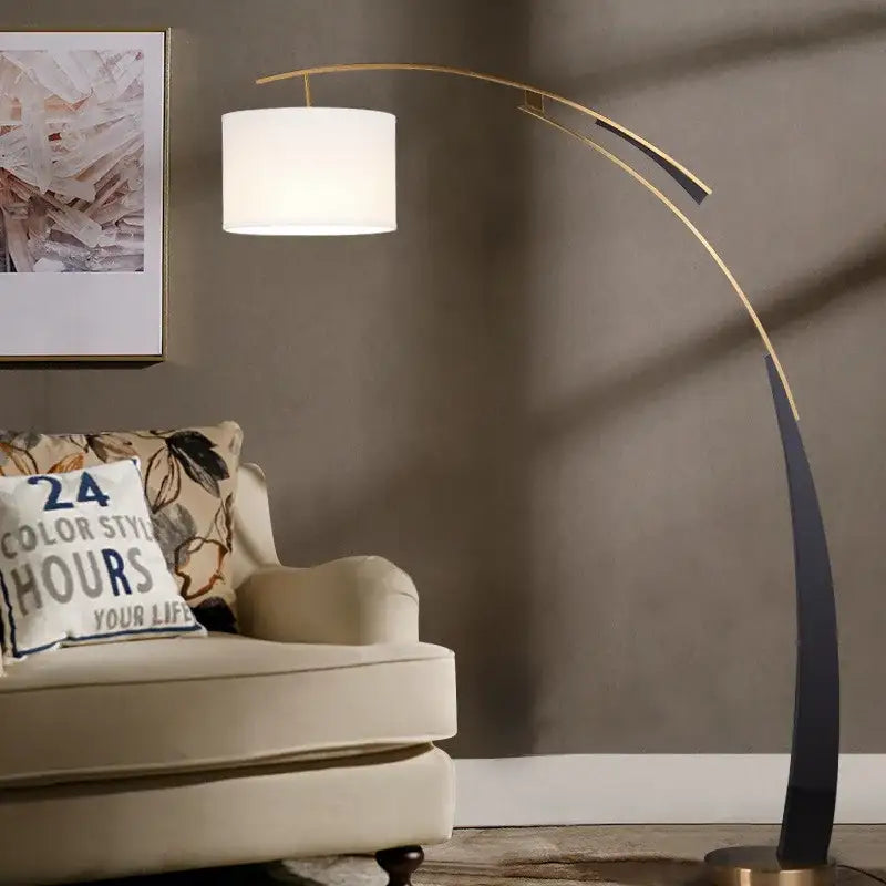 Modern gold adjustable metal floor lamp with white cylindrical shade and sleek curved frame for living room decorbites decor