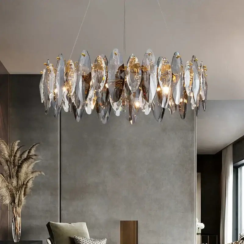 Modern gold amber decorbites crystal ceiling chandelier with translucent leaf-shaped glass and gold-toned metal accents