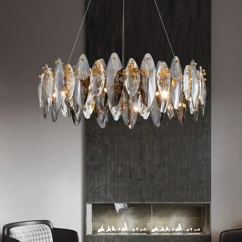 Modern gold amber decorbites crystal ceiling chandelier with clear faceted crystal leaves and gold metal fittings for dining room
