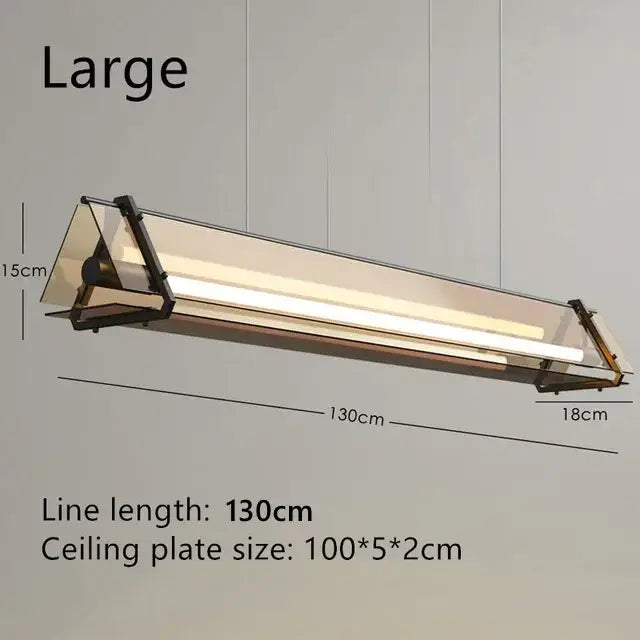 Modern gold amber led pendant lamp with sleek triangular frame and frosted glass panels for dining room decorbites amber led